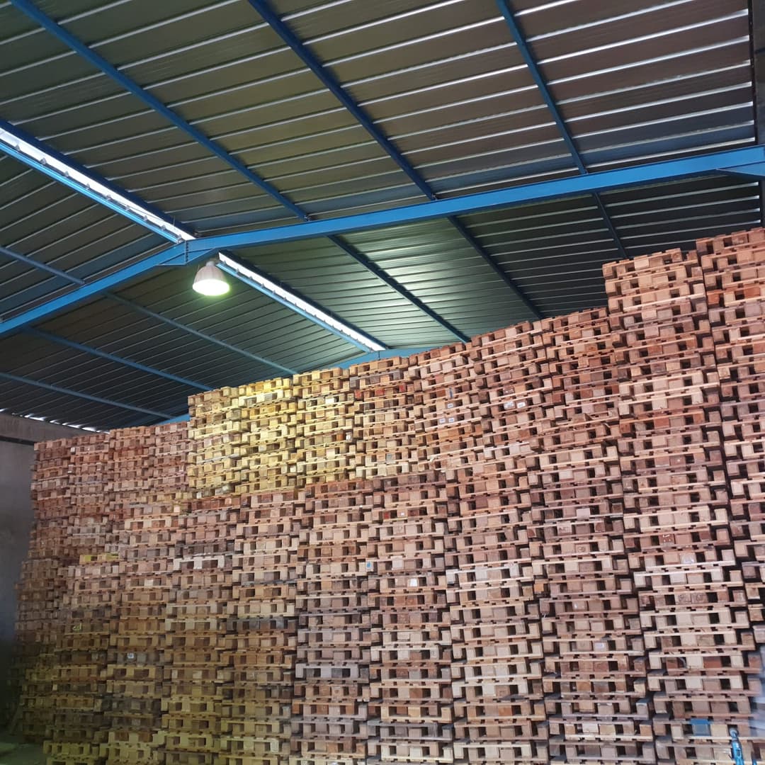 Craftsmen working on wooden pallets